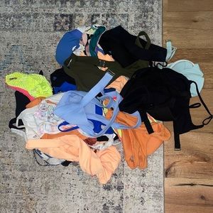 All of these bathing suits in the pile, some pictures included of some of them.